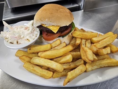 Picture of our burger with chips, and coleslaw. 