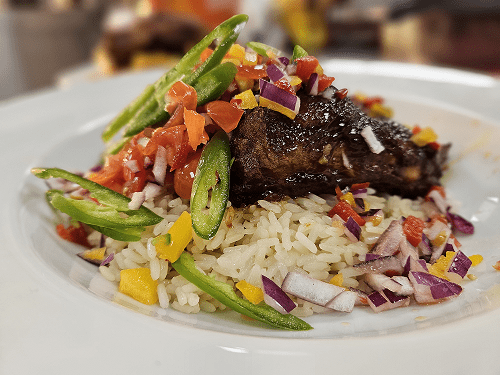 Picture of our BBQ pork Ribs on rice.
