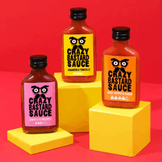 Image showing 3 bottles of Crazy Bastard Sauce.